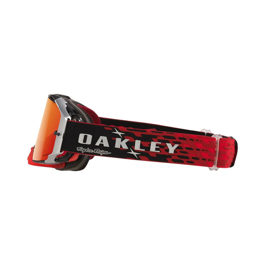 Zijaanzicht van de TLD Oakley airbrake crossbril waarbij je goed zicht hebt op de band. Het traditionele design met sterren in hierin terug te zien.
