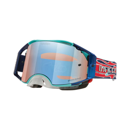 Deze speciale Troy Lee Designs crossbril heeft verschillende tinten blauw in het frame. Het blauwe spiegelglas en de blauw rode band maken het design af. 